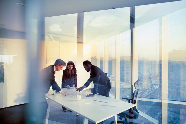 a group of people in a meeting