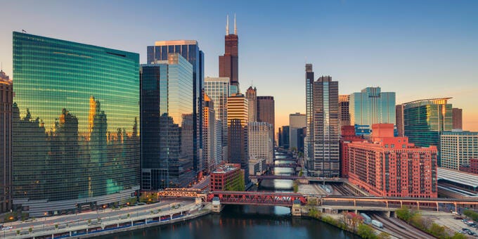 a city skyline with a river