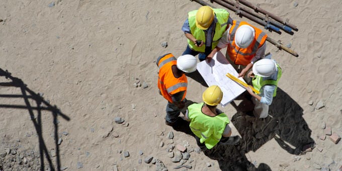 a group of people in construction gear