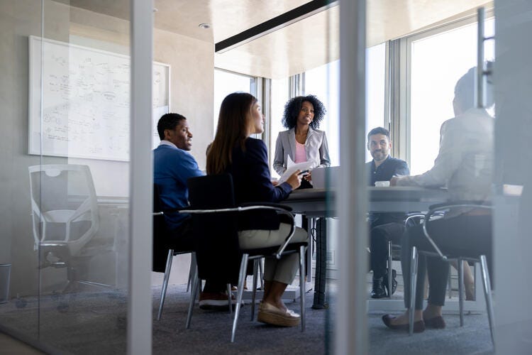 a group of people sitting around a table