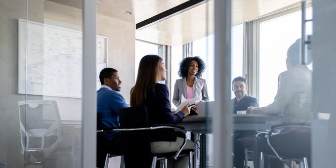 a group of people sitting around a table