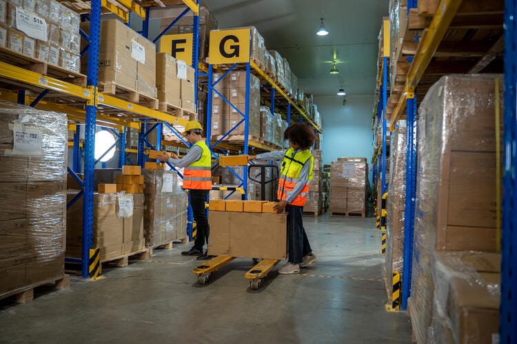 a couple of people in a warehouse