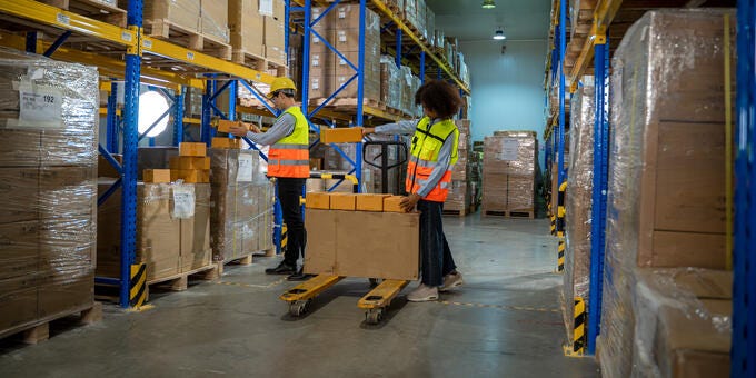 a couple of people in a warehouse