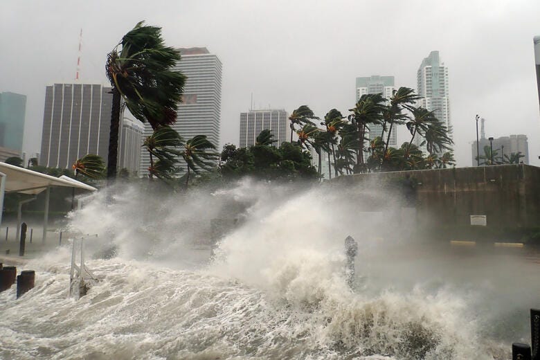 a large wave crashing into a city