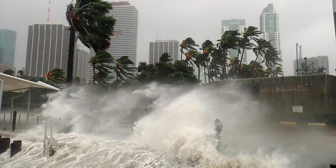 a large wave crashing into a city