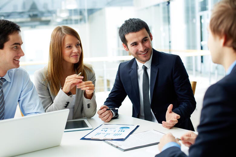 a group of people discussing something