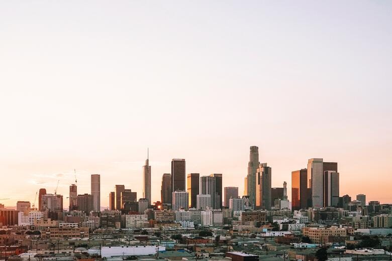 a city skyline with a river