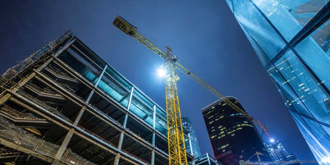 a crane next to a building