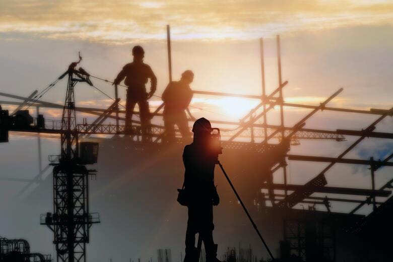 a group of men on a crane