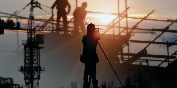 a group of men on a crane