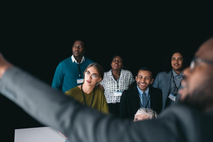 a group of people in a meeting